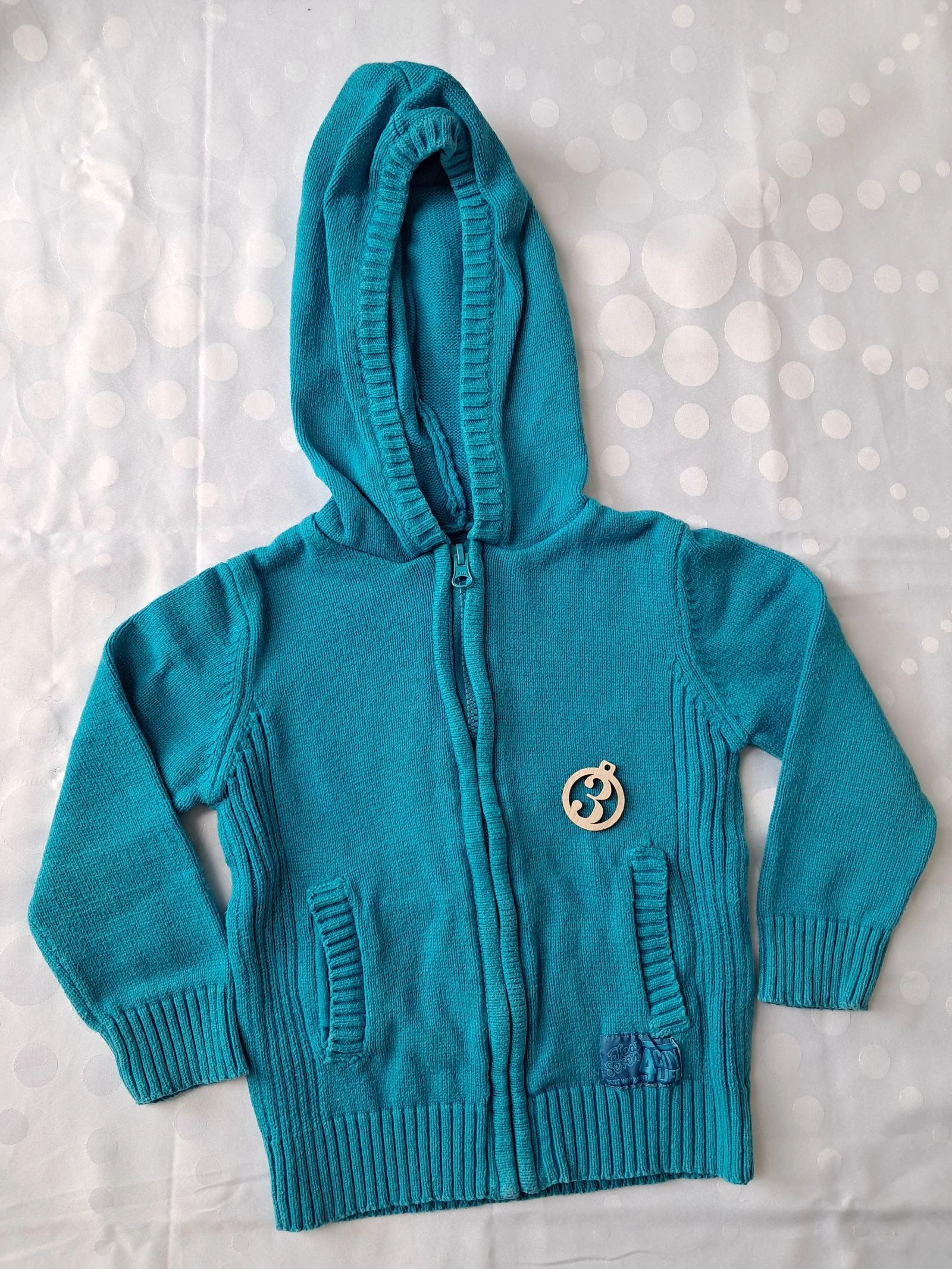 Gilet en laine turquois taille 3ans 
